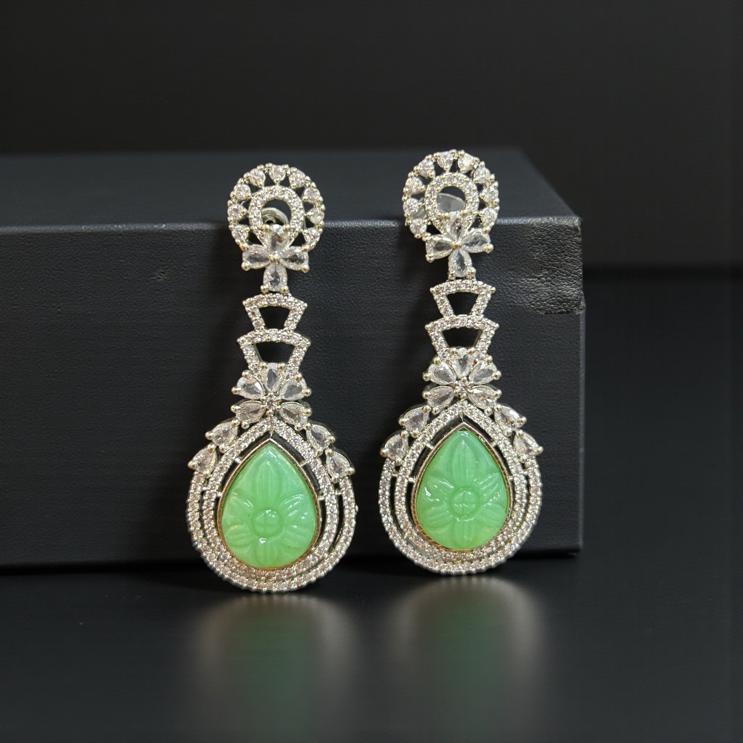 Green carved stone earrings by Kurti Connection USA