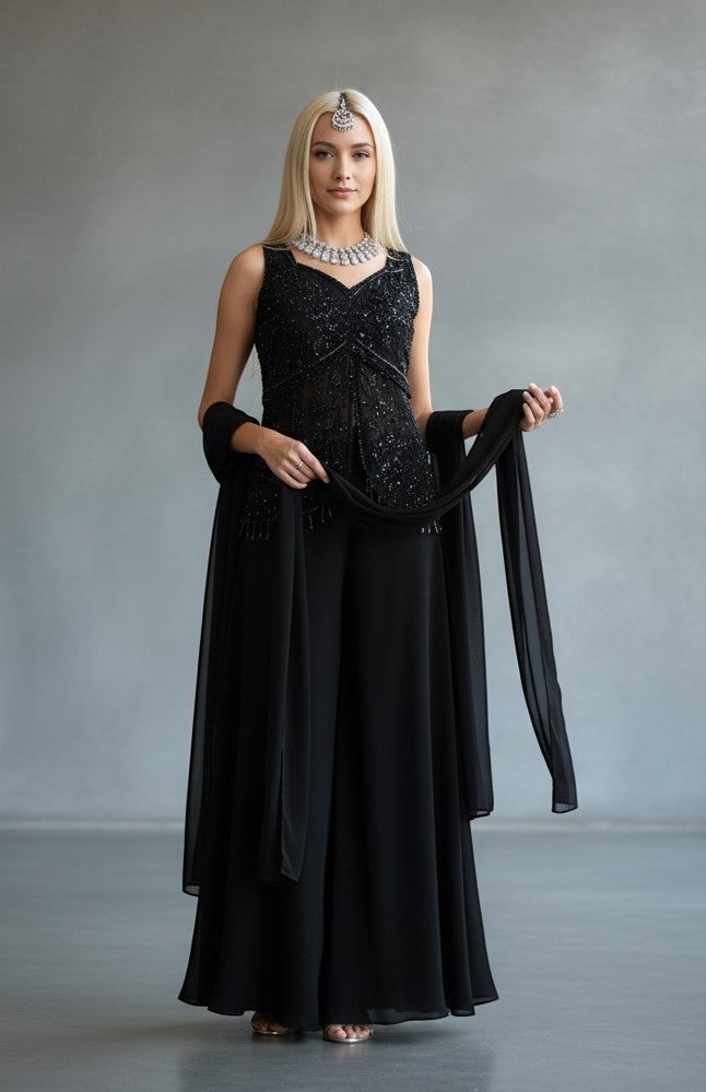House Of Indian Wedding Attire black sleeveless V-neck palazzo suit with intricate beadwork and sequins, paired with flowing pants and sheer dupatta.
