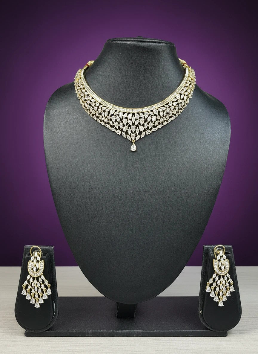 House Of Indian Wedding Attire gold-toned choker necklace and dangling earrings set with clear cubic zirconia stones.