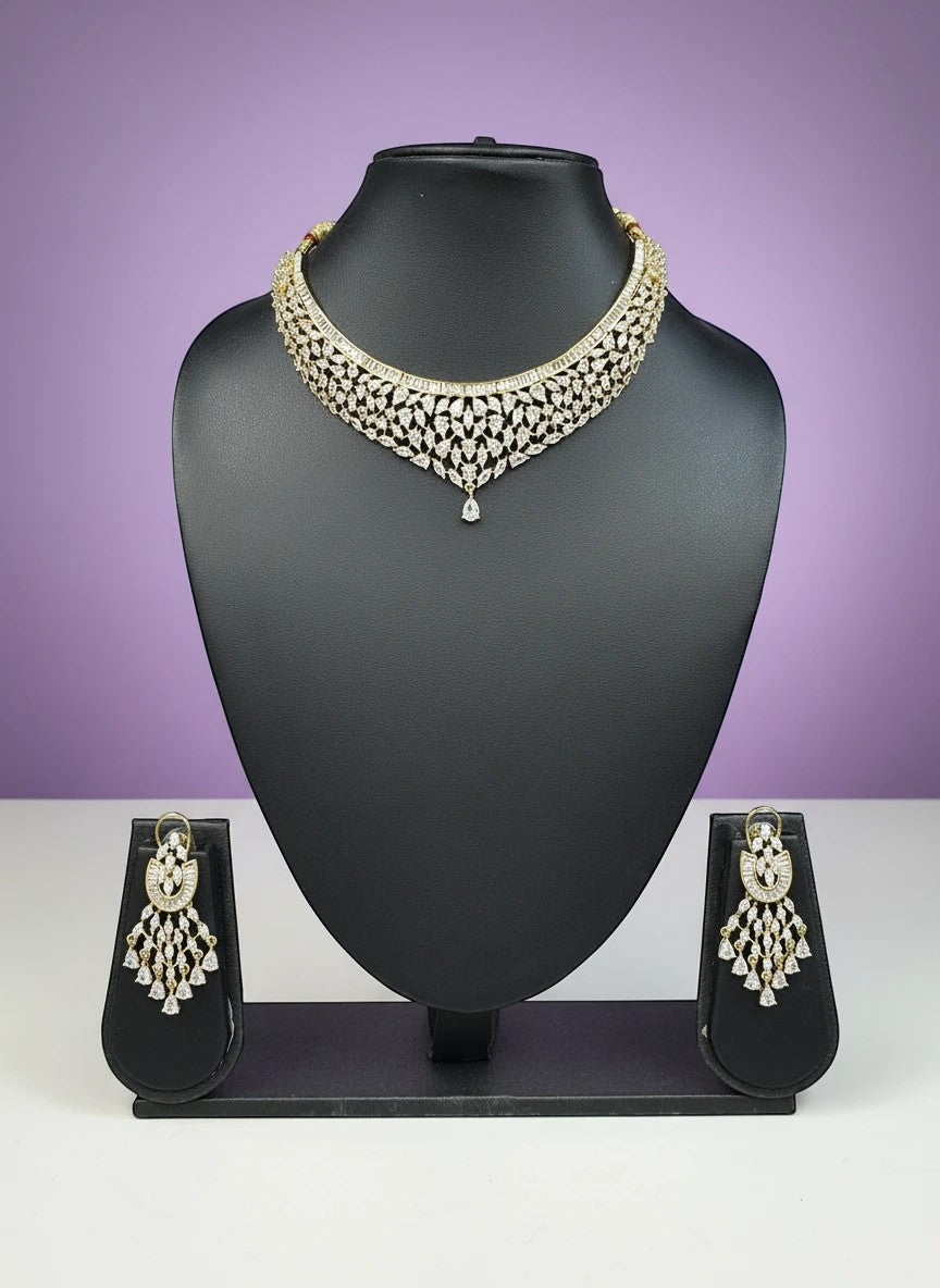 House Of Indian Wedding Attire gold-toned choker necklace and dangling earrings set with clear cubic zirconia stones.