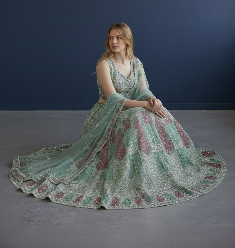 House Of Indian Wedding Attire light green lehenga choli set with intricate embroidery and sequin details, paired with a dupatta.