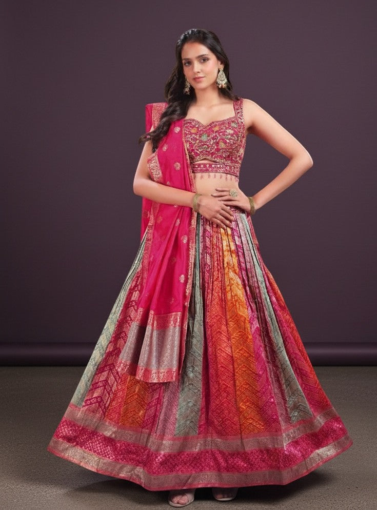 House Of Indian Wedding Attire silk lehenga choli set with a vibrant, multi-colored skirt and embellished pink choli.
