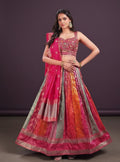 House Of Indian Wedding Attire silk lehenga choli set with a vibrant, multi-colored skirt and embellished pink choli.