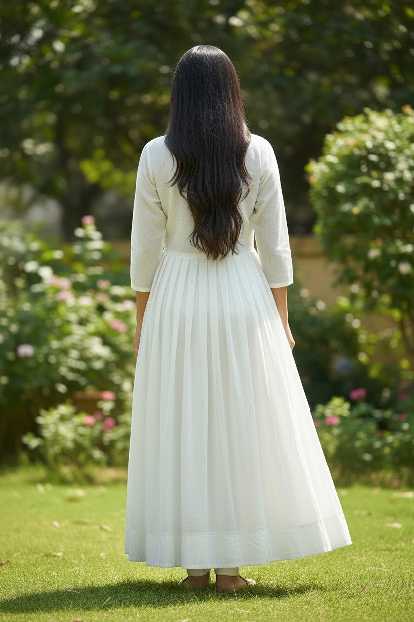 House Of Indian Wedding Attire white chiffon long kurti with pleated skirt and embroidered peacock detail.