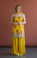 House Of Indian Wedding Attire sleeveless yellow sharara suit with floral print and gold sequin trim, paired with a dupatta.
