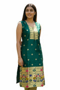 Kurti Connection USA emerald green silk sleeveless kurta with gold zari motifs, embellished neckline, and peacock border hem.