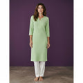 Kurti Connection USA light green textured cotton kurti with 3/4 sleeves and a V-neck, paired with white trousers.