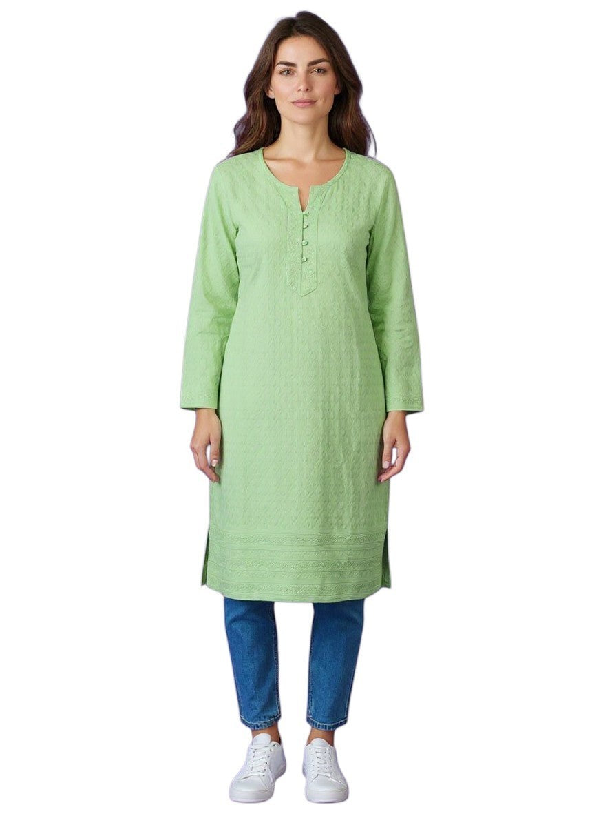 Kurti Connection USA light green textured cotton Chikankari kurti with button placket and side slits, worn by a woman with blue jeans.