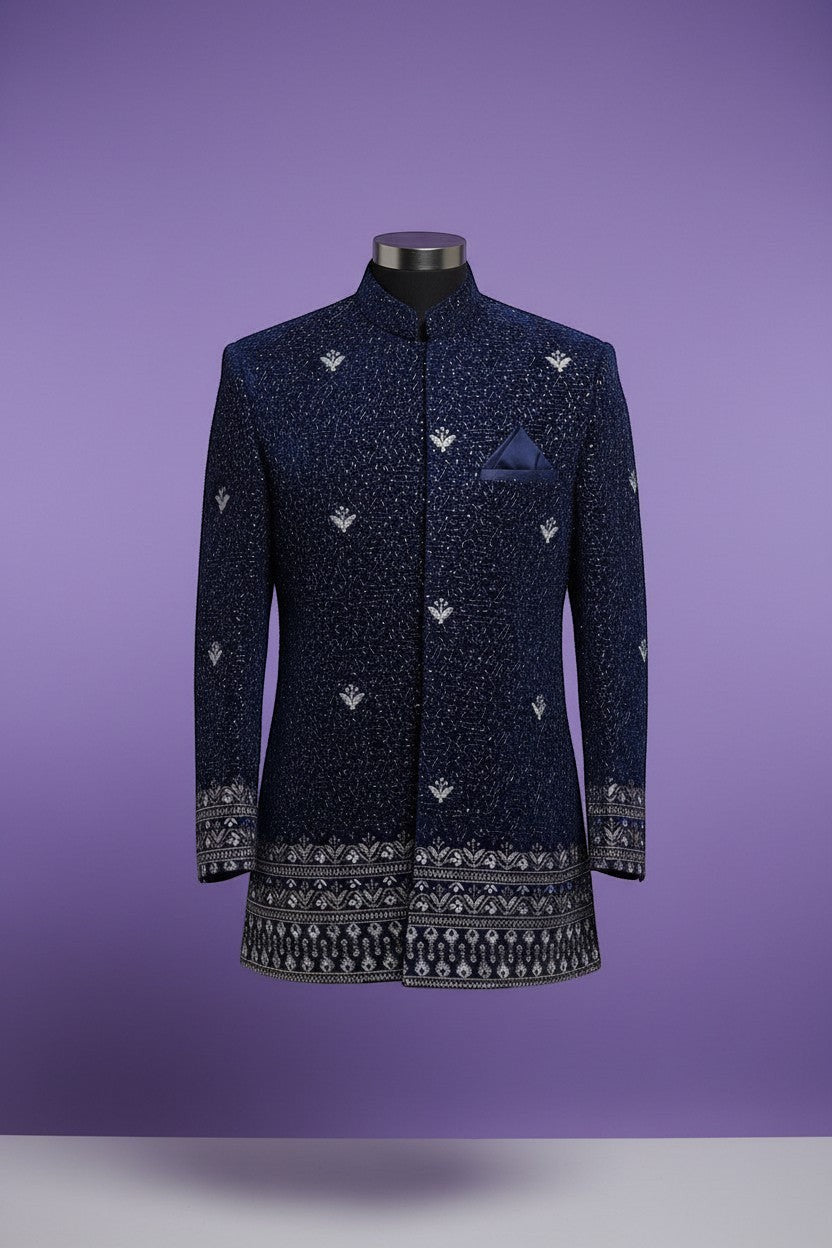 Kurti Connection USA navy blue Bandhgala jacket with silver embroidery and patterned border on cuffs and hem.