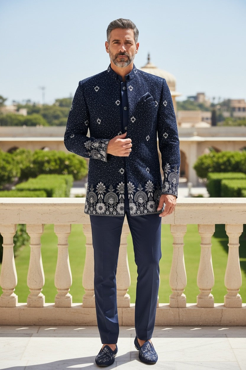 Kurti Connection USA navy blue embroidered Bandhgala suit with silver detailing on collar, cuffs, and hem. Model wears matching trousers.