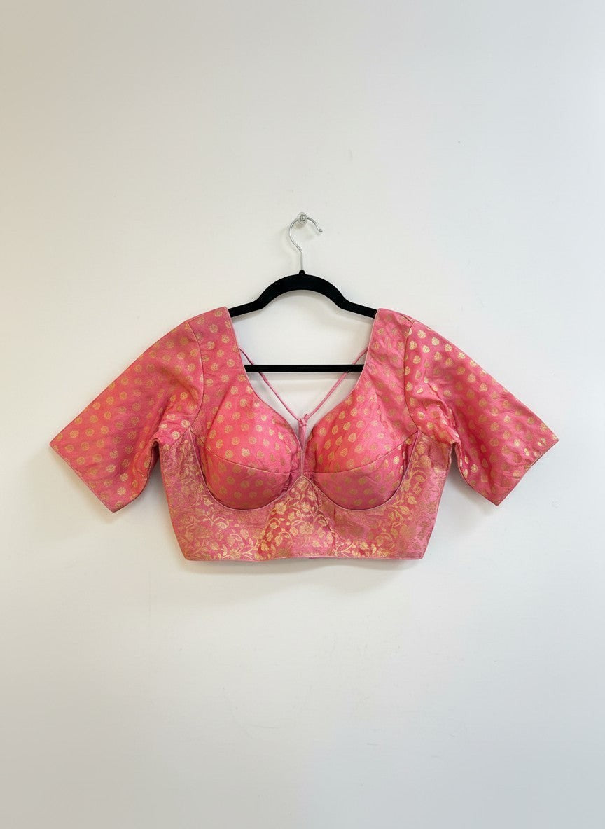 Kurti Connection USA pink brocade blouse with gold floral pattern, sweetheart neckline, criss-cross back, and short sleeves.