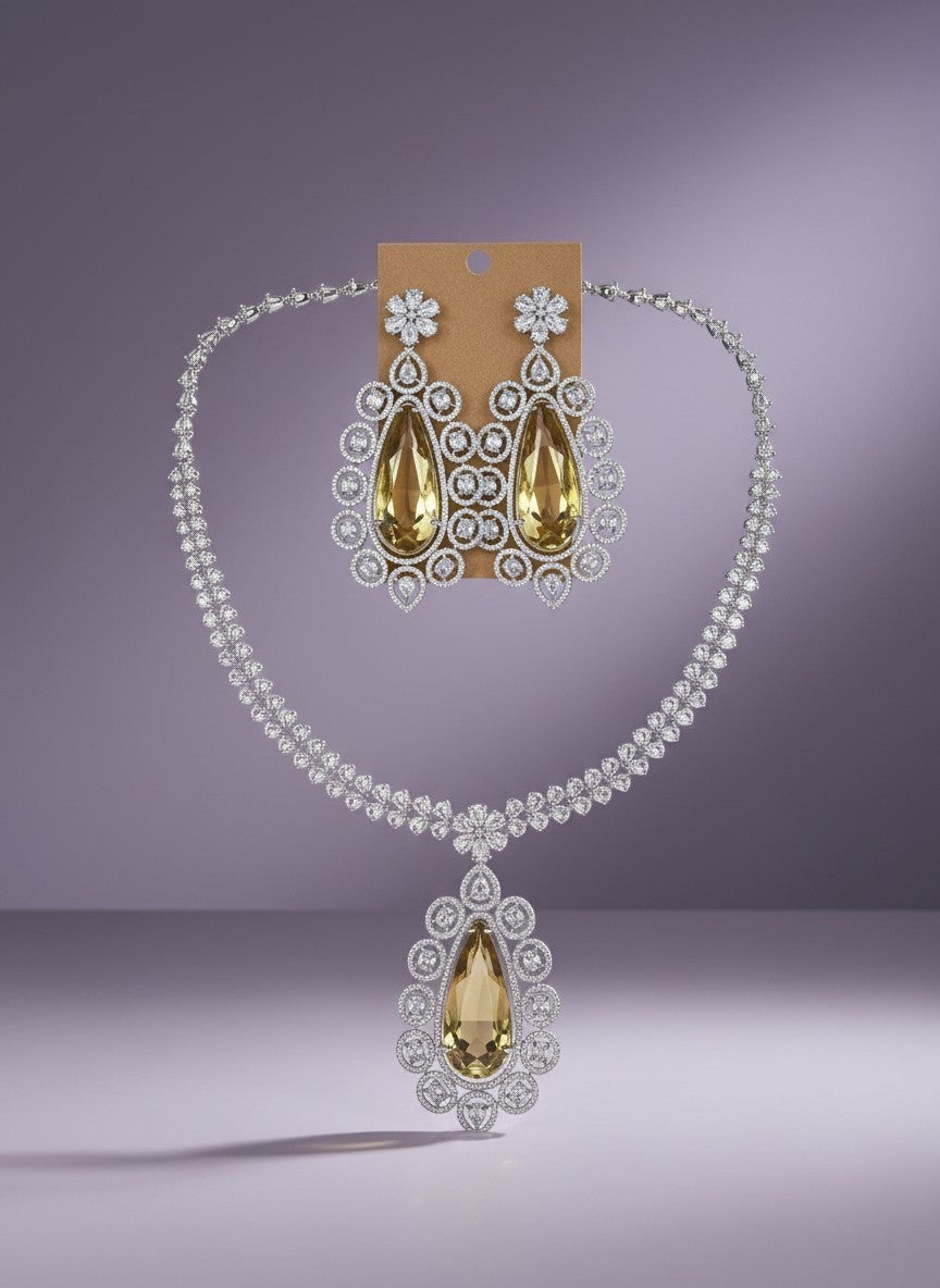 Kurti Connection USA statement necklace set with teardrop yellow stones and clear cubic zirconia, matching drop earrings.