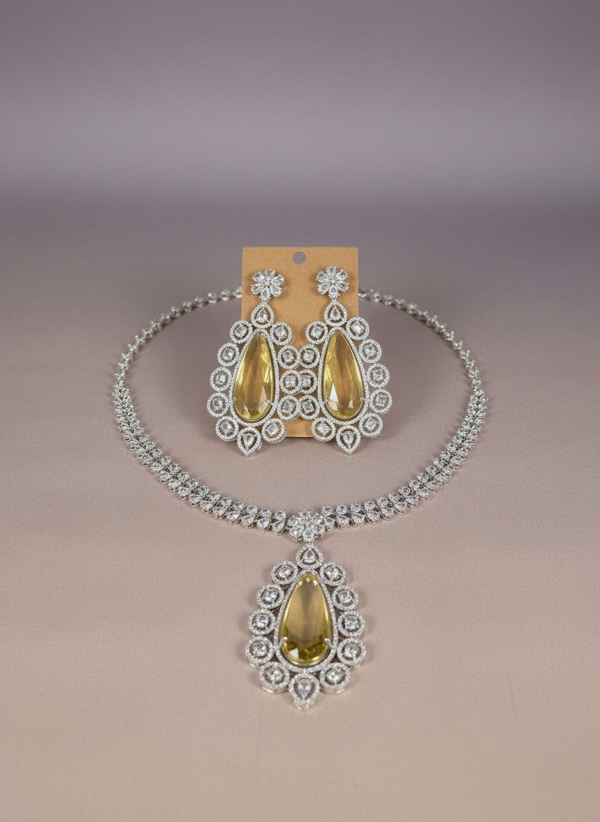 Kurti Connection USA statement necklace set with teardrop yellow stones and clear cubic zirconia in silver tone.