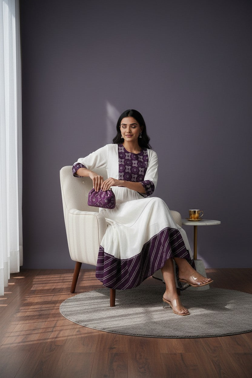 Kurti Connection USA white tiered maxi dress with purple embroidered yoke and cuffs, flowing silhouette.