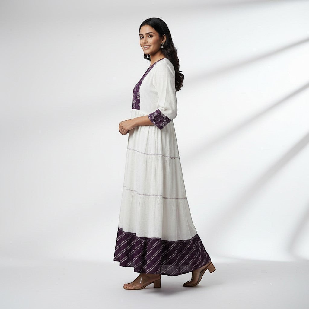 Kurti Connection USA white tiered maxi dress with embroidered purple yoke and cuffs, 3/4 sleeves, and patterned hem.